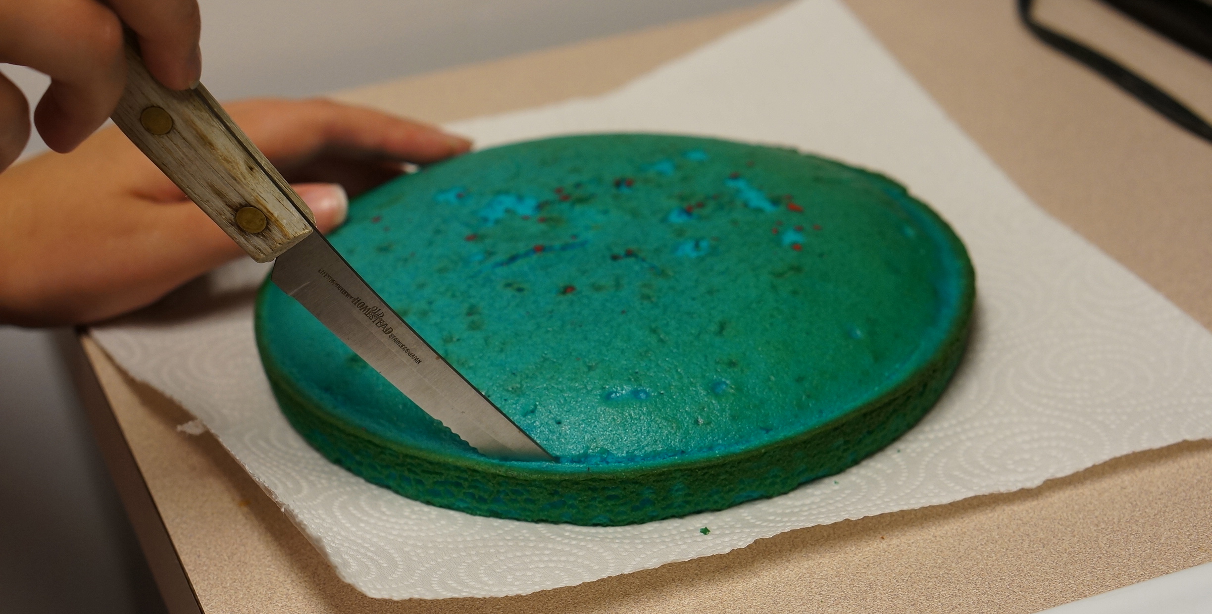 trim-edges-of-blue-cake